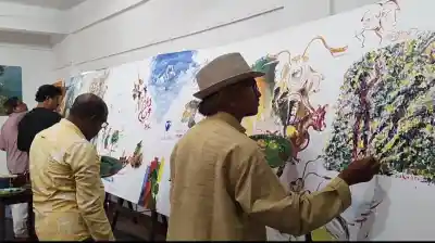 Artists celebrate World Art Day with massive 16-foot canvas near Dhauli Shanti Stupa