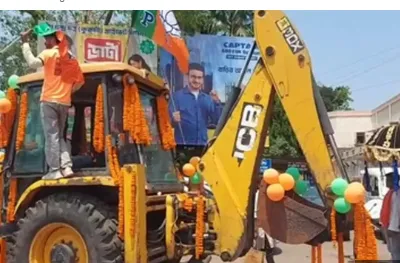 BJP candidate rides bulldozer to file his nomination in Bengal 