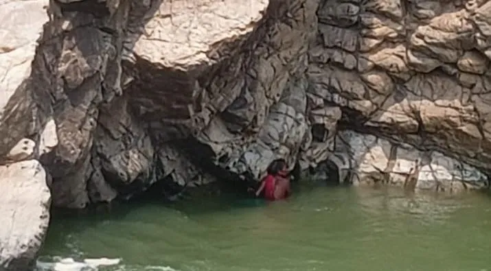 Elderly woman stranded on rock in Bhimkund, rescue operation underway

