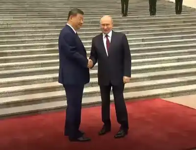 Vladimir Putin arrives in Beijing for high-stakes strategic talks with Xi Jinping after Trump visit