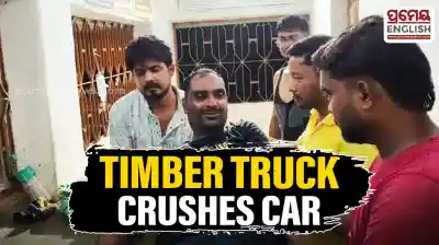 Timber-laden truck overturns onto car in Mayurbhanj Ghat road mishap; driver critically injured