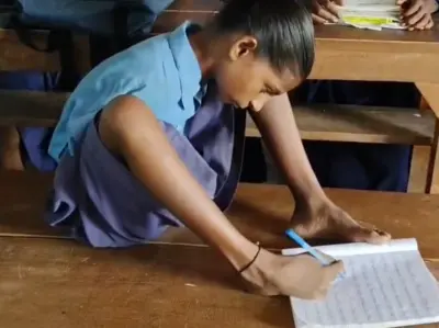13-year-old Lakshmi defies physical odds, uses her toes to hold pen and write