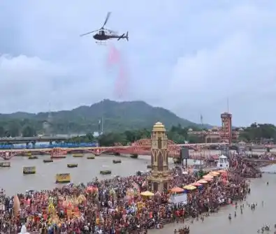 Flowers showered on Kanwariyas in Haridwar, CM Dhami washes devotees' feet