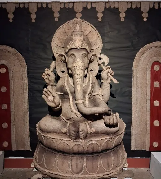 Young sculptors build stunning eight foot green Gajanana Idol using jute sacks and twine