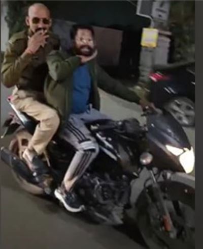 Police Constable penalized for smoking on moving bike in Indore