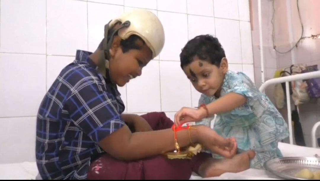 Conjoined twin survivor Jaga ties Rakhi in the hospital: Toddler sister Subhadra fastens wrist-band with fun & love 