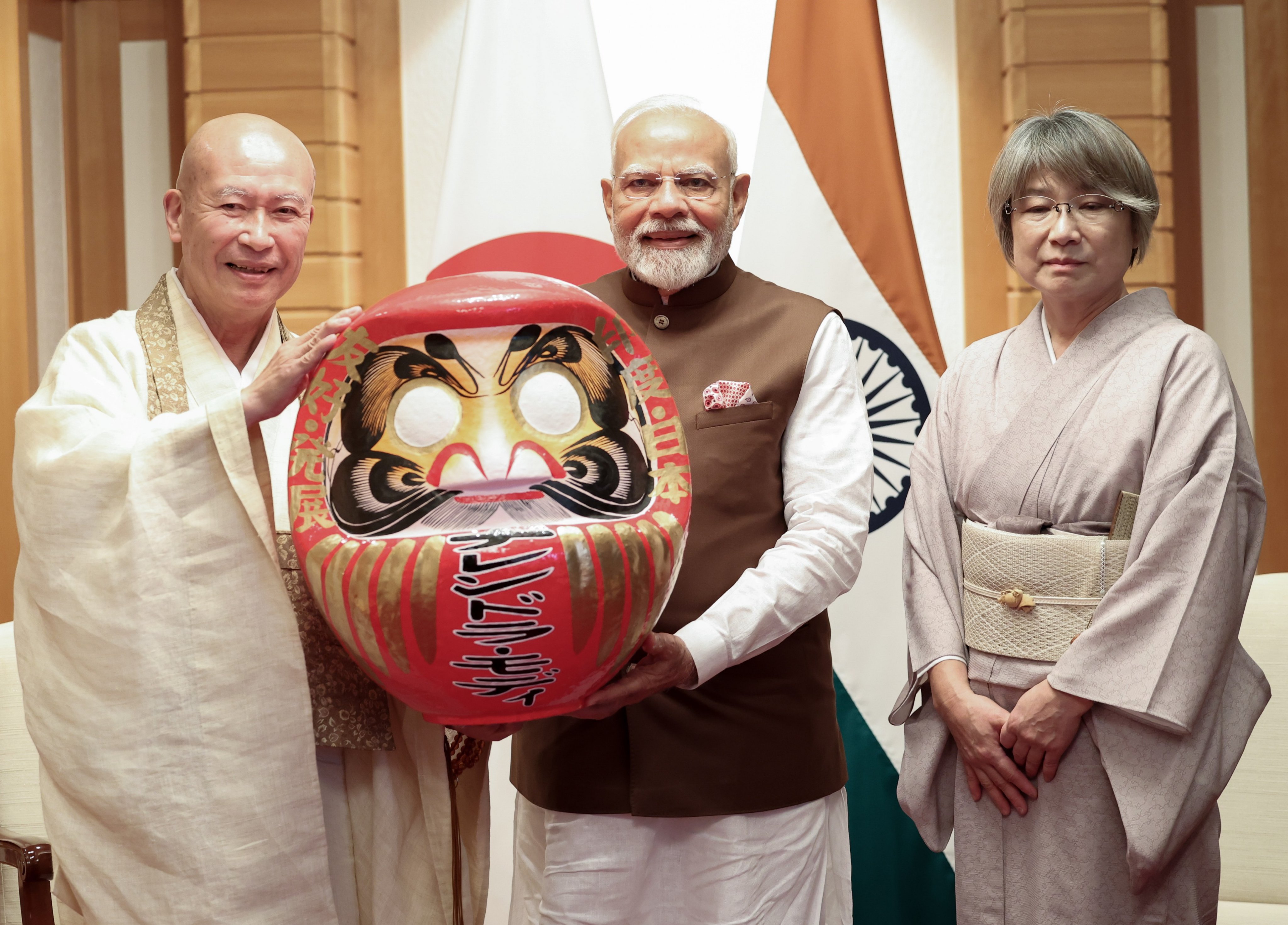 PM Modi receives a Daruma doll from Rev Seishi Hirose in Japan